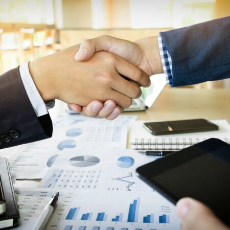 businessmen-shaking-hands-during-meeting